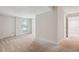 Finished basement space with neutral carpet, access to outside, and access to other finished spaces at 3783 Ardsley Ct, Marietta, GA 30062