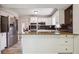 Modern kitchen featuring stainless steel appliances, granite counters, and white cabinets, ideal for preparing gourmet meals at 3783 Ardsley Ct, Marietta, GA 30062