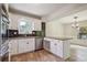 Well-lit kitchen with white cabinetry, granite countertops, stainless steel appliances, and an open layout for easy cooking at 3783 Ardsley Ct, Marietta, GA 30062