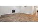 Open living room featuring wood-look tile flooring and a cozy fireplace for a welcoming ambiance at 3783 Ardsley Ct, Marietta, GA 30062