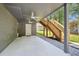 Covered outdoor patio area with access to stairs and backyard at 3783 Ardsley Ct, Marietta, GA 30062