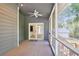 Carpeted screened porch with ceiling fan and view through double doors to another room and through screens to outside at 3783 Ardsley Ct, Marietta, GA 30062