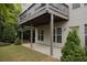 Backyard view featuring deck, patio, and well-maintained landscaping at 6614 Covered Bridge Way, Braselton, GA 30548