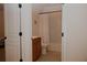 Bathroom includes shower/tub with a curtain, wood vanity, and neutral tile floor at 6614 Covered Bridge Way, Braselton, GA 30548