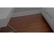 Close up view of the bedroom floor and part of the bed and a nightstand at 6614 Covered Bridge Way, Braselton, GA 30548