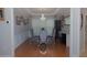 Formal dining room featuring tray ceiling, chandelier, and wood floors at 6614 Covered Bridge Way, Braselton, GA 30548
