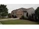 Charming home with brick accents, well-maintained landscaping, and a two-car garage at 6614 Covered Bridge Way, Braselton, GA 30548
