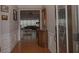 Welcoming entry hallway with wood floors leads into home with open living space at 6614 Covered Bridge Way, Braselton, GA 30548