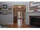 Inviting entry hallway leads to the house with a fireplace, hardwood floors and detailed trim at 6614 Covered Bridge Way, Braselton, GA 30548