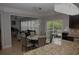 Open concept kitchen, includes granite countertops and easy access to backyard patio at 6614 Covered Bridge Way, Braselton, GA 30548