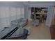 Open-concept living area with stylish seating and views into the kitchen at 6614 Covered Bridge Way, Braselton, GA 30548