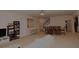 Spacious living room includes staircase and dining room area at 6614 Covered Bridge Way, Braselton, GA 30548