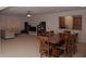 The open-concept living room and kitchen offers a welcoming space for relaxation and entertaining at 6614 Covered Bridge Way, Braselton, GA 30548