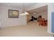 The open-concept living room and dining area provide ample space at 6614 Covered Bridge Way, Braselton, GA 30548