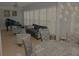 Cozy living area featuring stylish seating, lighting, and piano at 6614 Covered Bridge Way, Braselton, GA 30548