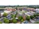 Aerial view of an attractive downtown area with mixed-use buildings, green spaces and ample parking at 7235 Cordery Rd, Cumming, GA 30040