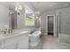 Beautiful bathroom features a soaking tub, a walk-in shower, and dual vanities at 7235 Cordery Rd, Cumming, GA 30040