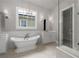 Elegant bathroom features a soaking tub, a walk-in shower, and modern fixtures at 7235 Cordery Rd, Cumming, GA 30040