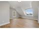 A bright bedroom with natural light, hardwood floors and unique architecture on the ceiling at 7235 Cordery Rd, Cumming, GA 30040