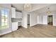 Open living room features a built-in desk area and natural light at 7235 Cordery Rd, Cumming, GA 30040
