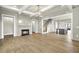 Spacious living room boasts hardwood floors, a fireplace, and an open floor plan at 7235 Cordery Rd, Cumming, GA 30040