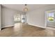 Bright living room with hardwood floors and an open floor plan at 7235 Cordery Rd, Cumming, GA 30040