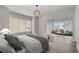 Serene main bedroom with a sitting area and views of the neighborhood at 7235 Cordery Rd, Cumming, GA 30040