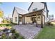 Inviting backyard with a brick patio, outdoor seating, and lush landscaping, perfect for relaxing and entertaining at 7275 Cordery Rd, Cumming, GA 30040