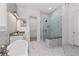 Modern bathroom featuring a glass shower and white marble tiling at 7275 Cordery Rd, Cumming, GA 30040