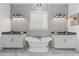 Elegant bathroom with dual sinks, a freestanding tub, and sleek fixtures at 7275 Cordery Rd, Cumming, GA 30040