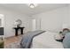 Bright bedroom featuring hardwood floors, soft lighting, and neutral decor at 7275 Cordery Rd, Cumming, GA 30040