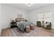 Bright bedroom with hardwood floors, modern furniture, and lots of natural light at 7275 Cordery Rd, Cumming, GA 30040