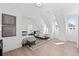 Bright bedroom with hardwood floors, modern furniture, and lots of natural light at 7275 Cordery Rd, Cumming, GA 30040
