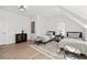Bright bedroom with hardwood floors, modern furniture, and lots of natural light at 7275 Cordery Rd, Cumming, GA 30040