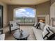 Inviting covered balcony with comfortable seating, a fireplace, and views of the city skyline at 88 W Paces Ferry # 2230, Atlanta, GA 30305