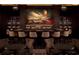 Sophisticated bar area with a large painted mural, seating, and stocked shelves at 88 W Paces Ferry # 2230, Atlanta, GA 30305
