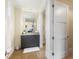 Stylish bathroom with a gray vanity, granite countertop, and a large mirror at 88 W Paces Ferry # 2230, Atlanta, GA 30305