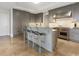 Spacious kitchen with a large center island, stainless steel appliances, and stylish bar seating at 88 W Paces Ferry # 2230, Atlanta, GA 30305