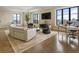 Spacious living room with large windows, modern furnishings, and stunning city views at 88 W Paces Ferry # 2230, Atlanta, GA 30305