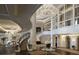 Grand foyer boasting a curved staircase, elegant lighting, and sophisticated decor at 88 W Paces Ferry # 2230, Atlanta, GA 30305