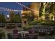 Cozy patio space with outdoor seating, lighting, fireplace, and landscaped surroundings at 88 W Paces Ferry # 2230, Atlanta, GA 30305