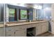 The large bathroom has granite counters, double sinks, and a large vanity with stool at 204 Queensbury Ct, Acworth, GA 30102