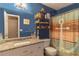 Bathroom with blue walls, a granite vanity top, and an anchor-themed shower curtain at 204 Queensbury Ct, Acworth, GA 30102