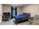 Bedroom with laminate floor, a blue blanket on the bed, and a window for natural light at 204 Queensbury Ct, Acworth, GA 30102