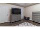 Bedroom with a tv, light grey dresser, and light wood floor at 204 Queensbury Ct, Acworth, GA 30102