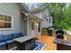 Charming outdoor deck featuring a dining table, BBQ grill, and comfortable lounge seating at 204 Queensbury Ct, Acworth, GA 30102