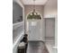 Inviting entryway with hardwood floors and a charming decorative light fixture at 204 Queensbury Ct, Acworth, GA 30102