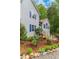 Well-maintained front yard features landscaping and stairs to entrance at 204 Queensbury Ct, Acworth, GA 30102