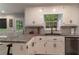 Bright kitchen with stainless steel appliances, white cabinets, and granite countertops at 204 Queensbury Ct, Acworth, GA 30102