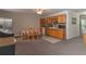 The open kitchen features oak cabinets, stainless appliances, and a cozy eating area at 204 Queensbury Ct, Acworth, GA 30102
